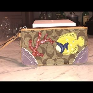 Small Coach wristlet with fish detail